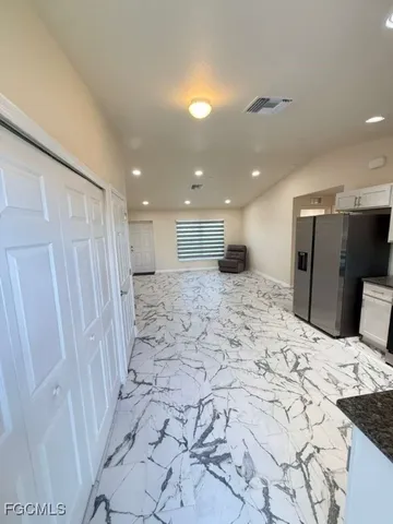 a large bathroom with a sink and a shower