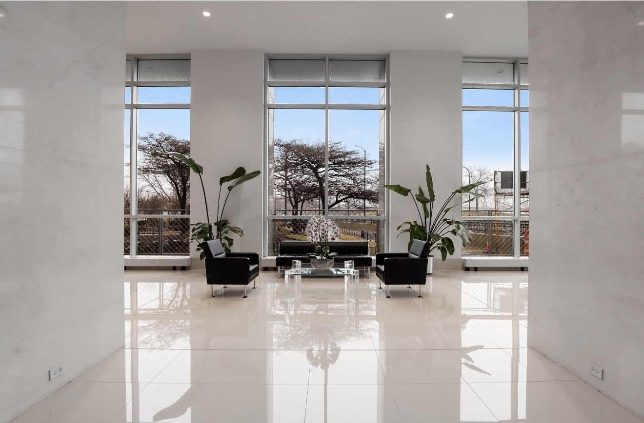 1550 North Lake Shore Drive, Unit 9F Chicago, IL 60610 - Photo 13 of 19 a room with furniture and a potted plant