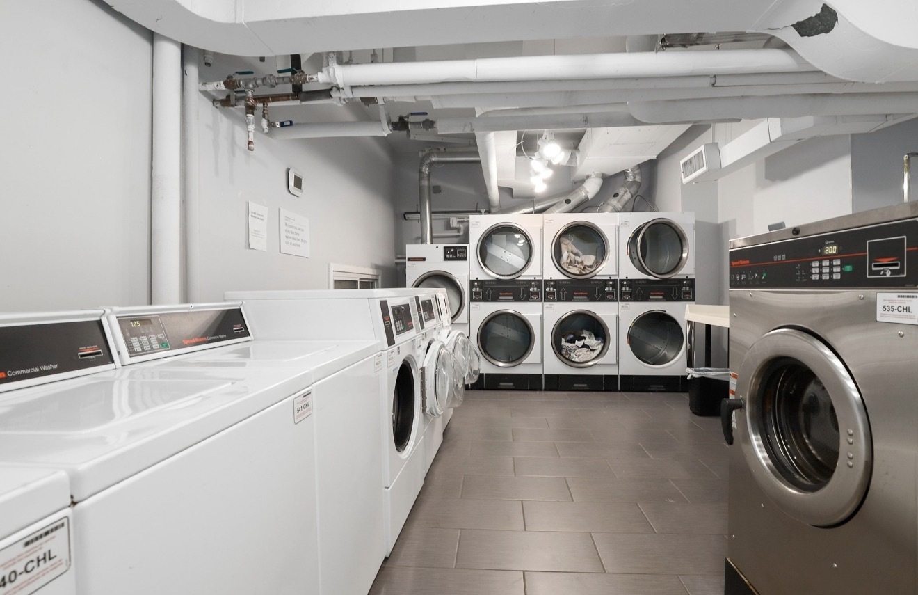 1550 North Lake Shore Drive, Unit 9F Chicago, IL 60610 - Photo 16 of 19 a utility room with dryer and washer