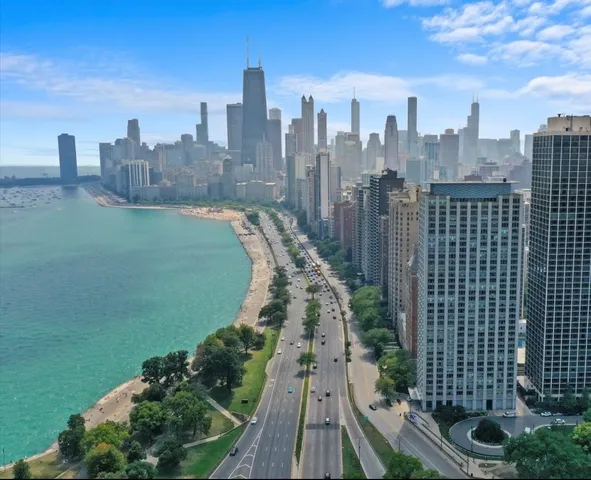 a view of roof deck with wooden floor and seating space