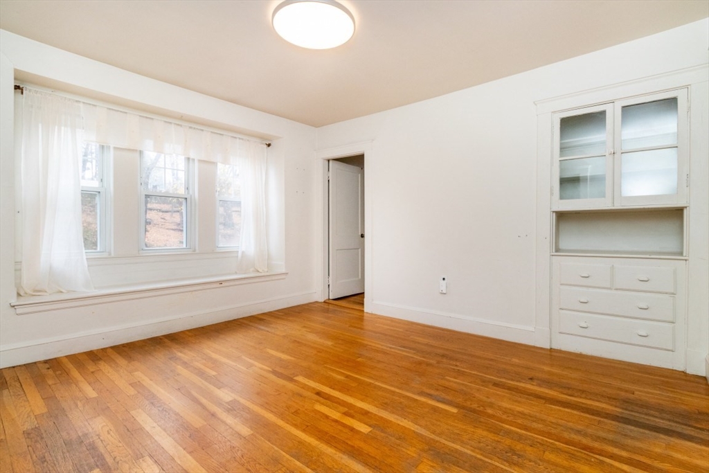 151 Pine Street, Unit 2 Quincy, MA 02170 - Photo 3 of 11 a view of an empty room with a window