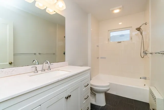 a bathroom with a sink a toilet and a bathtub