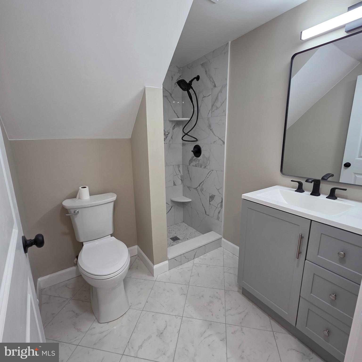 12702 Knights Road Philadelphia, PA 19154 - Photo 15 of 23 a bathroom with a sink toilet and shower