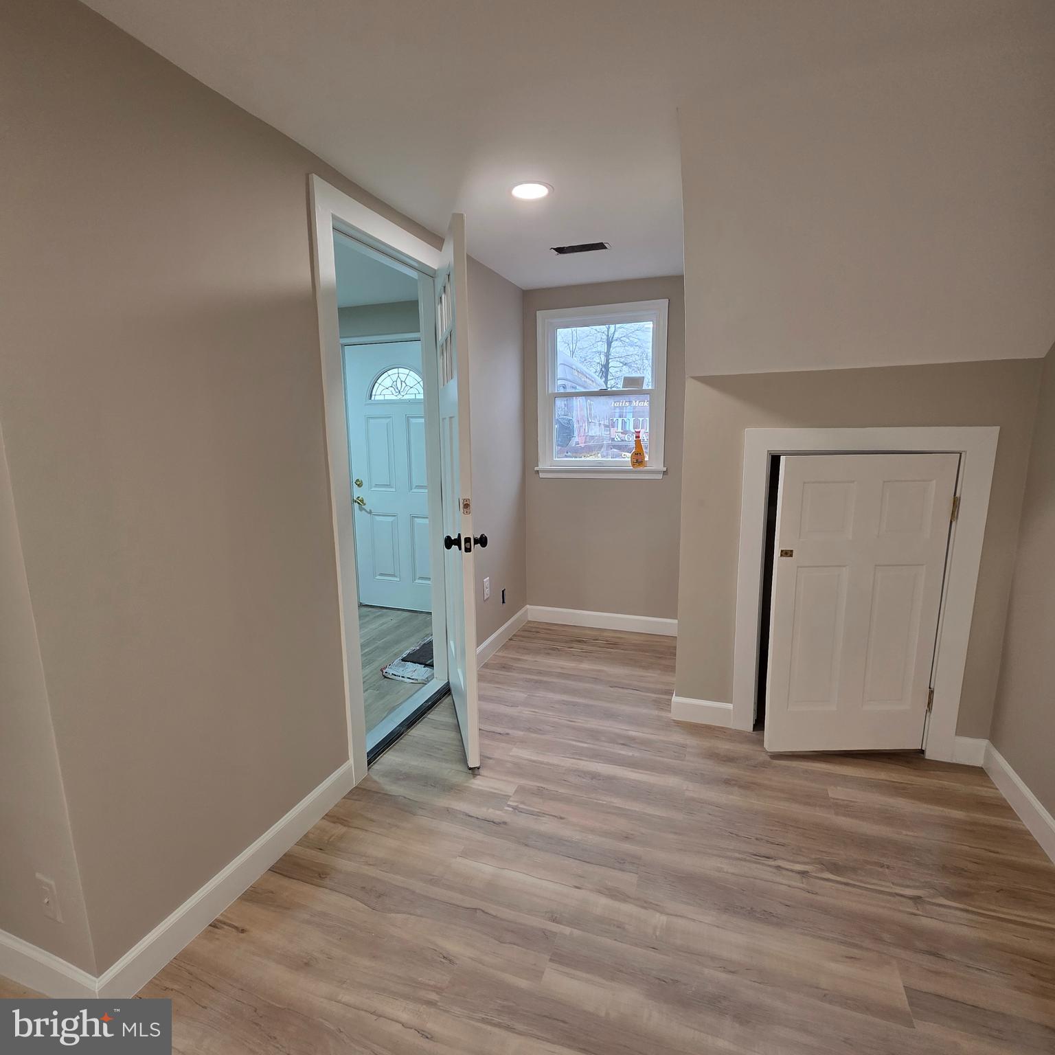 12702 Knights Road Philadelphia, PA 19154 - Photo 17 of 23 a view of an empty room with wooden floor and a window