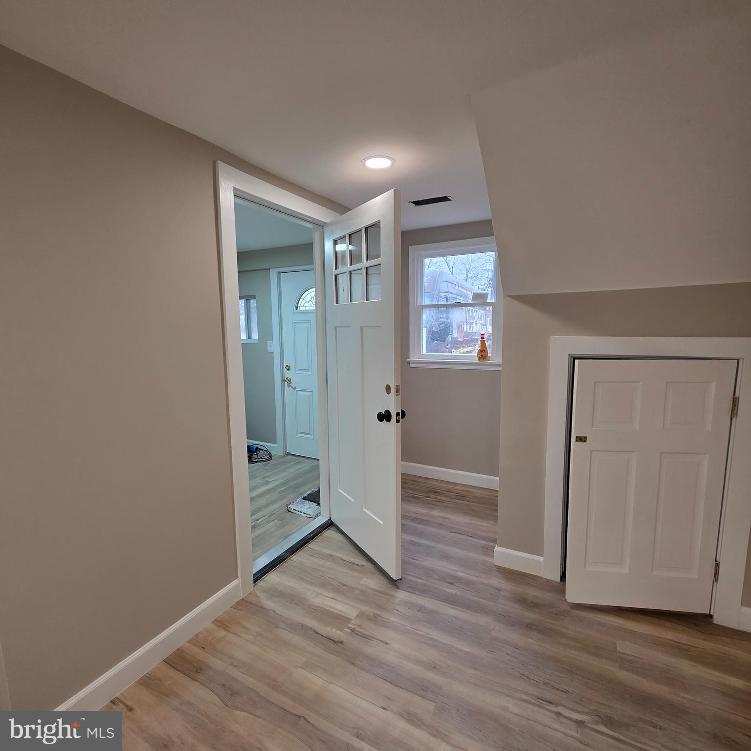 12702 Knights Road Philadelphia, PA 19154 - Photo 18 of 23 an empty room with wooden floor and windows