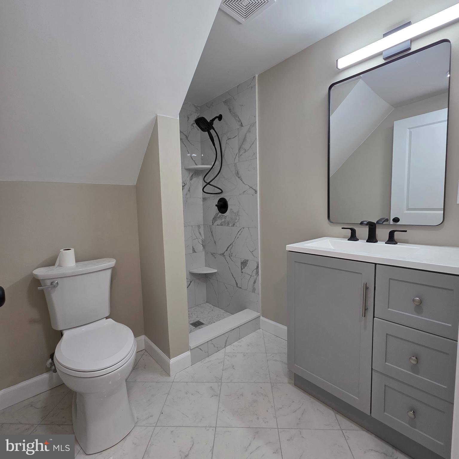 12702 Knights Road Philadelphia, PA 19154 - Photo 22 of 23 a bathroom with a toilet sink and shower