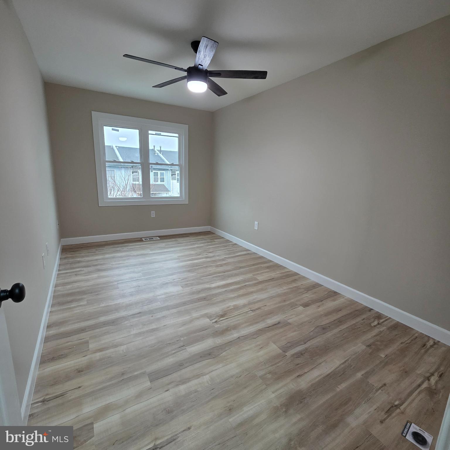 12702 Knights Road Philadelphia, PA 19154 - Photo 7 of 23 an empty room with wooden floor fan and windows