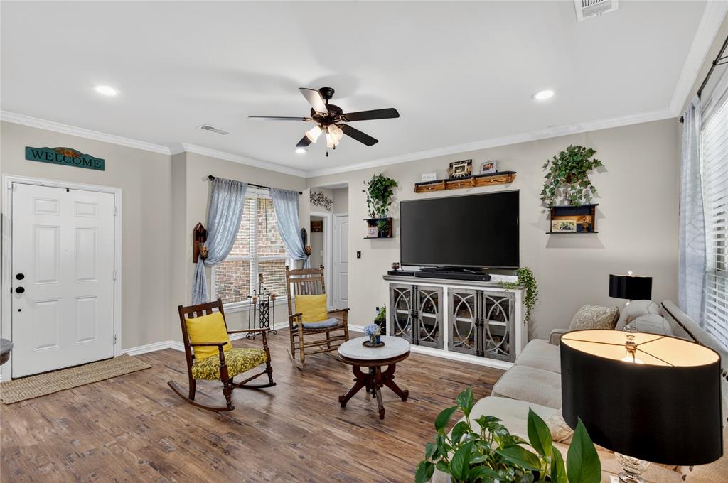 701 West Lamberth Road Sherman, TX 75092 - Photo 11 of 37 Living area featuring wood-finish flooring, a ceiling fan with integrated lighting, and recessed lighting