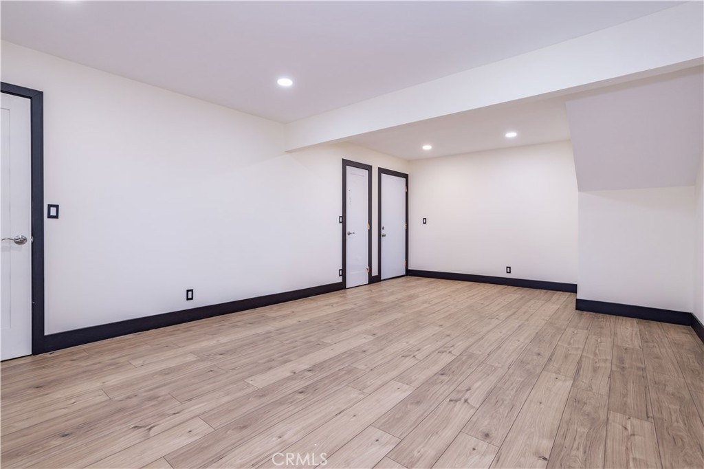 42640 Ranch Club Road Lake Hughes, CA 93532 - Photo 17 of 27 a view of an empty room with wooden floor