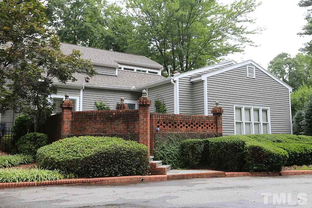 2023 Landings Way Raleigh, NC 27615 - Photo 1 of 25 a front view of a house with a garden