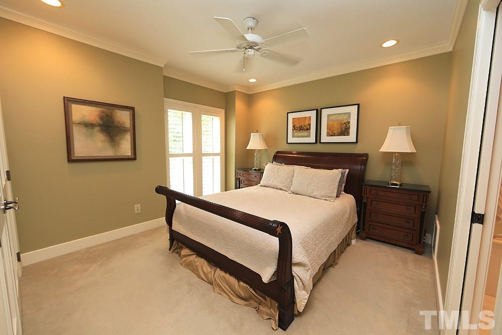 2023 Landings Way Raleigh, NC 27615 - Photo 15 of 25 a bedroom with a bed and a painting on the wall