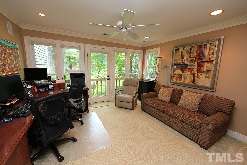 2023 Landings Way Raleigh, NC 27615 - Photo 21 of 25 a living room with furniture and a flat screen tv