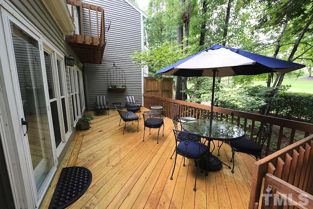 2023 Landings Way Raleigh, NC 27615 - Photo 23 of 25 a view of balcony with wooden floor and outdoor seating