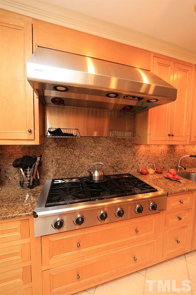 2023 Landings Way Raleigh, NC 27615 - Photo 6 of 25 a stove top oven sitting inside of a kitchen