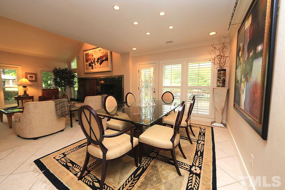 2023 Landings Way Raleigh, NC 27615 - Photo 8 of 25 a dining room with furniture and a floor to ceiling window