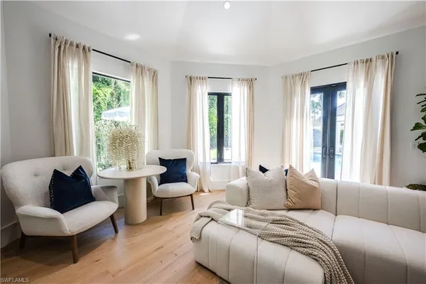 a bedroom with furniture and windows