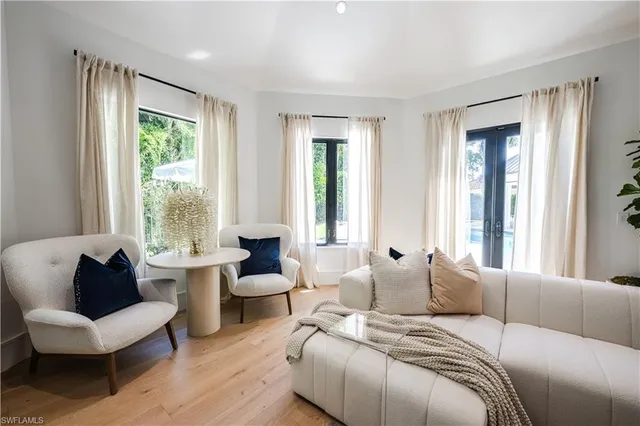 a bedroom with furniture and windows