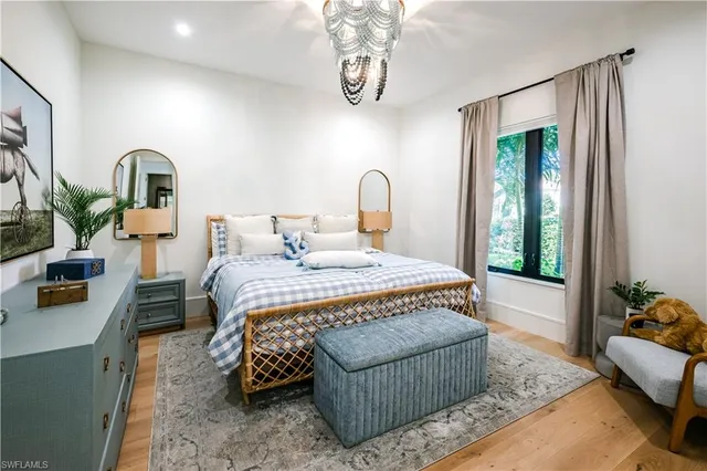 a bedroom with bed and window