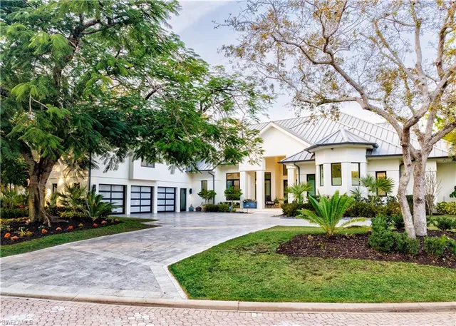 front view of a house with a garden