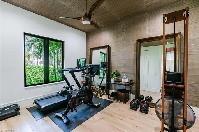 a view of a livingroom with workspace and a window