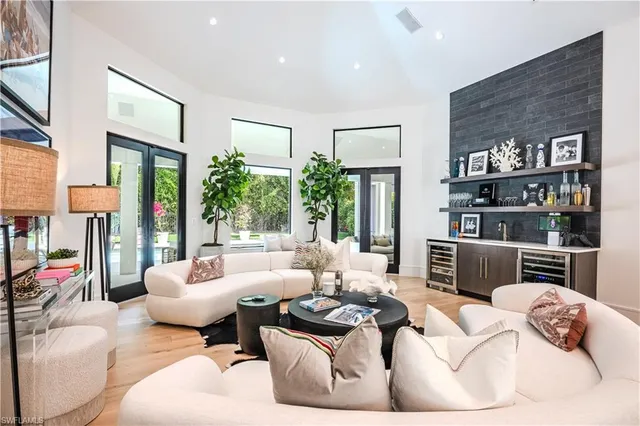 a living room with furniture or couch and a floor to ceiling window