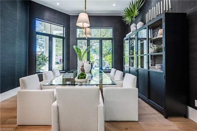 a dining room with furniture a livingroom and chandelier