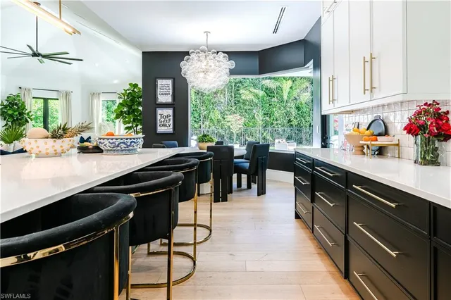 a kitchen with stainless steel appliances granite countertop sink stove and cabinets