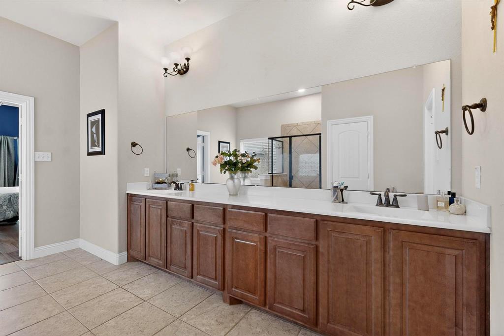 3608 Bright Star Way Plano, TX 75074 - Photo 18 of 40 a spacious bathroom with a double vanity sink mirror and