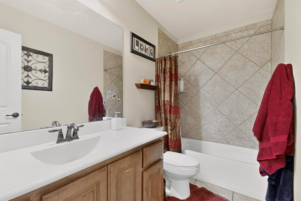 3608 Bright Star Way Plano, TX 75074 - Photo 25 of 40 a bathroom with a sink and a mirror