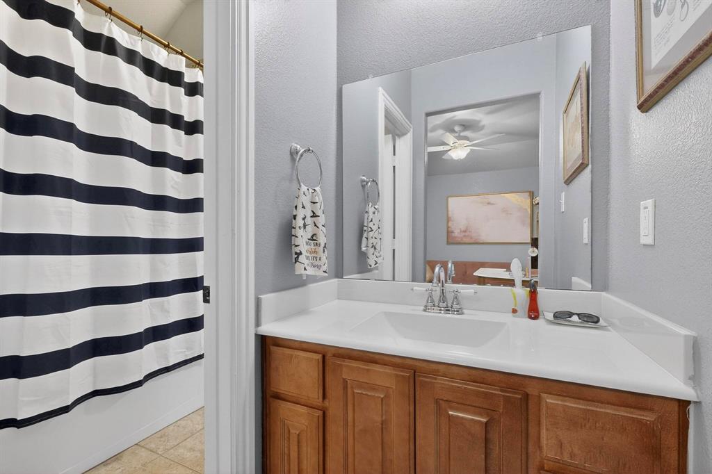 3608 Bright Star Way Plano, TX 75074 - Photo 29 of 40 a bathroom with a sink and a mirror