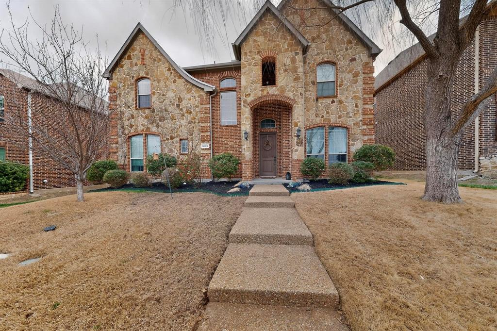 3608 Bright Star Way Plano, TX 75074 - Photo 3 of 40 a front view of a house with a yard and garage