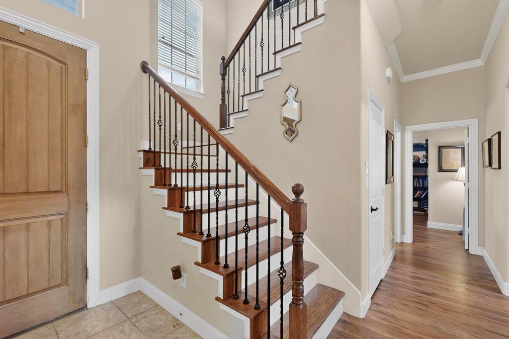 3608 Bright Star Way Plano, TX 75074 - Photo 5 of 40 a view of staircase with wooden floor and white walls
