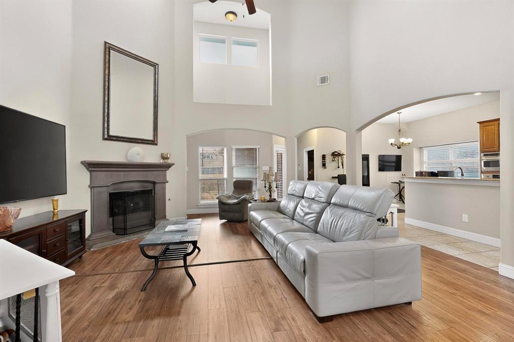 3608 Bright Star Way Plano, TX 75074 - Photo 8 of 40 a living room with furniture fireplace and flat screen tv