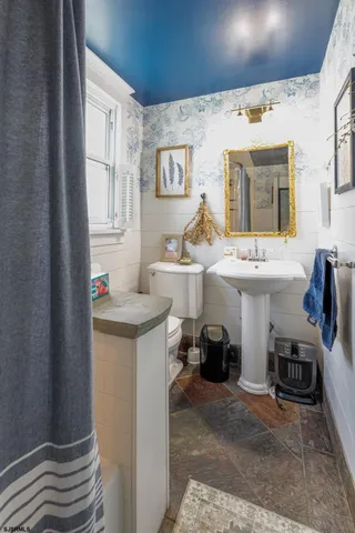 a kitchen with a sink and a stove top oven