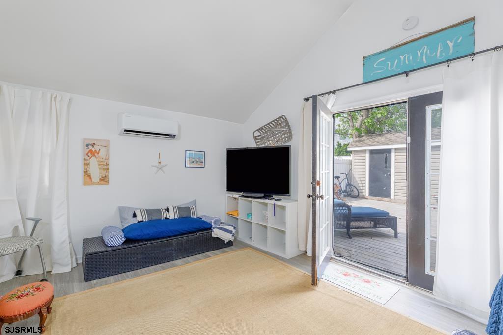 100 Decatur Avenue Somers Point, NJ 08244 - Photo 15 of 52 a living room with furniture and a flat screen tv