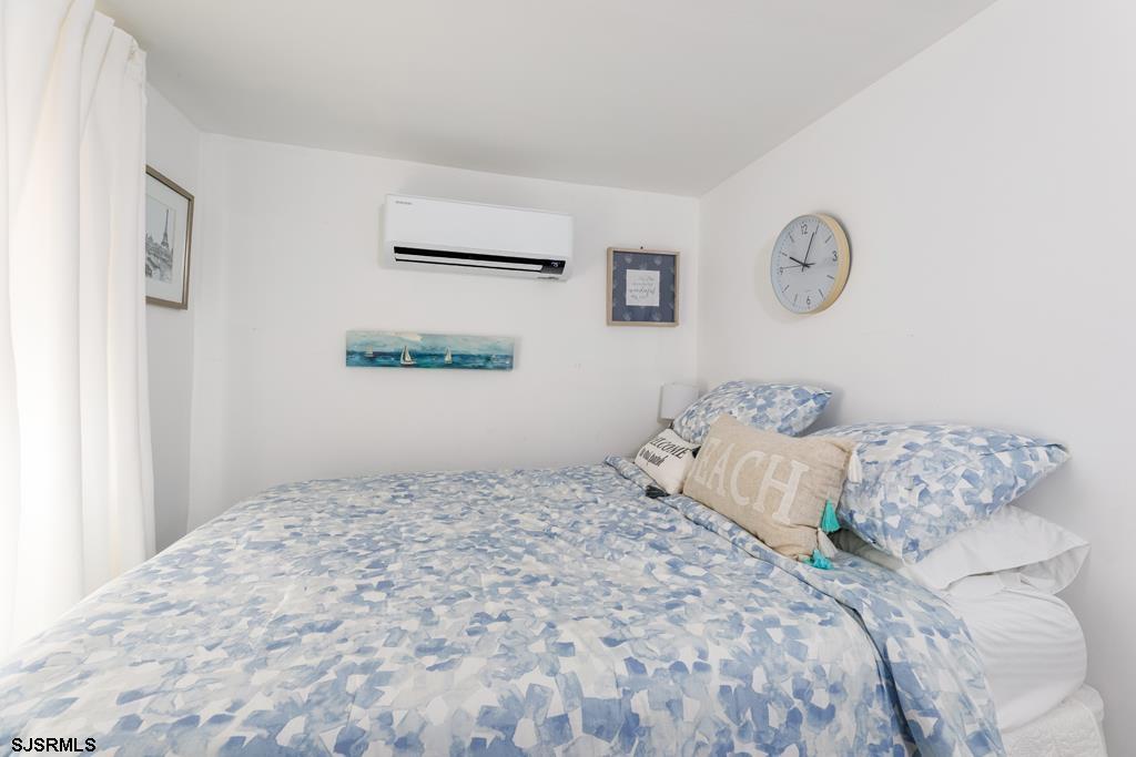 100 Decatur Avenue Somers Point, NJ 08244 - Photo 19 of 52 a bedroom with a large bed and a window