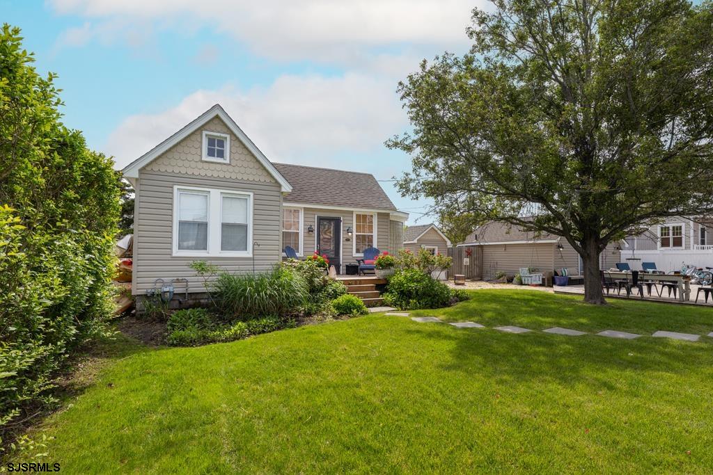 100 Decatur Avenue Somers Point, NJ 08244 - Photo 25 of 52 a front view of a house with a yard and trees