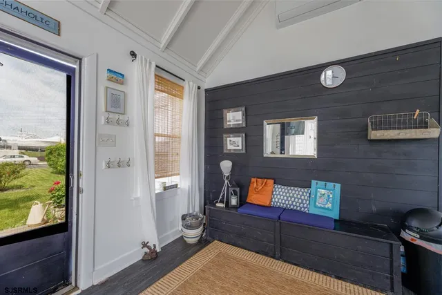 a view of a livingroom with furniture and window