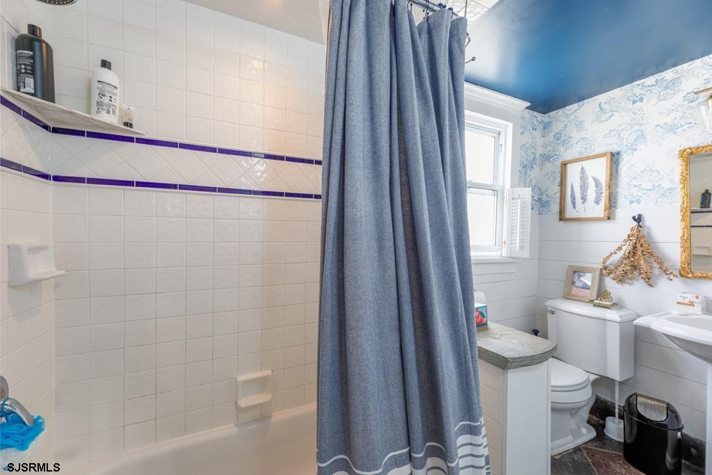 100 Decatur Avenue Somers Point, NJ 08244 - Photo 10 of 52 a bathroom with a sink a toilet a window and shower