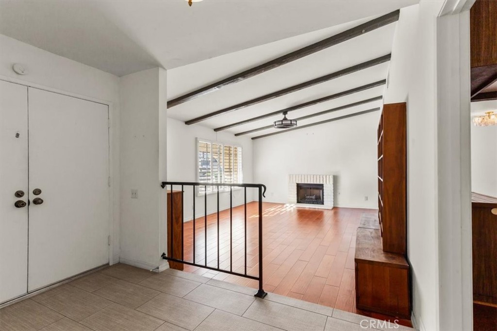 2250 Tamarisk Road Palm Springs, CA 92262 - Photo 11 of 36 a view of a hallway with wooden floor and entryway