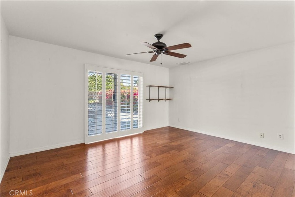 2250 Tamarisk Road Palm Springs, CA 92262 - Photo 29 of 36 wooden floor in an empty room with a window