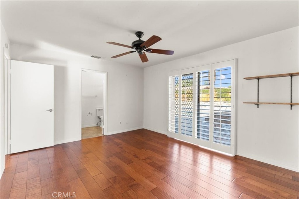 2250 Tamarisk Road Palm Springs, CA 92262 - Photo 30 of 36 a view of empty room with wooden floor and fan
