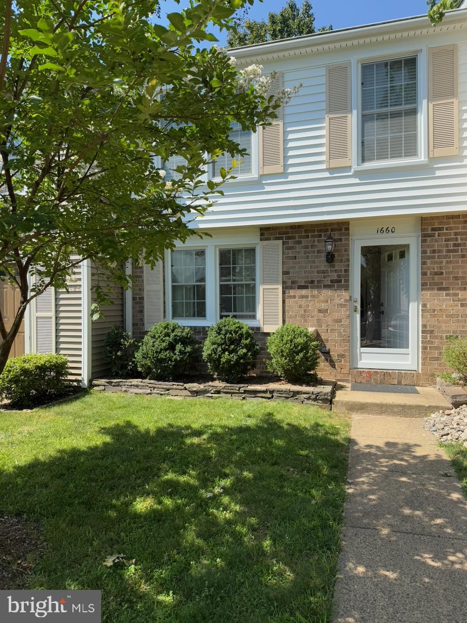 1660 Sierra Woods Drive Reston, VA 20194 - Photo 1 of 1 a front view of a house with a yard