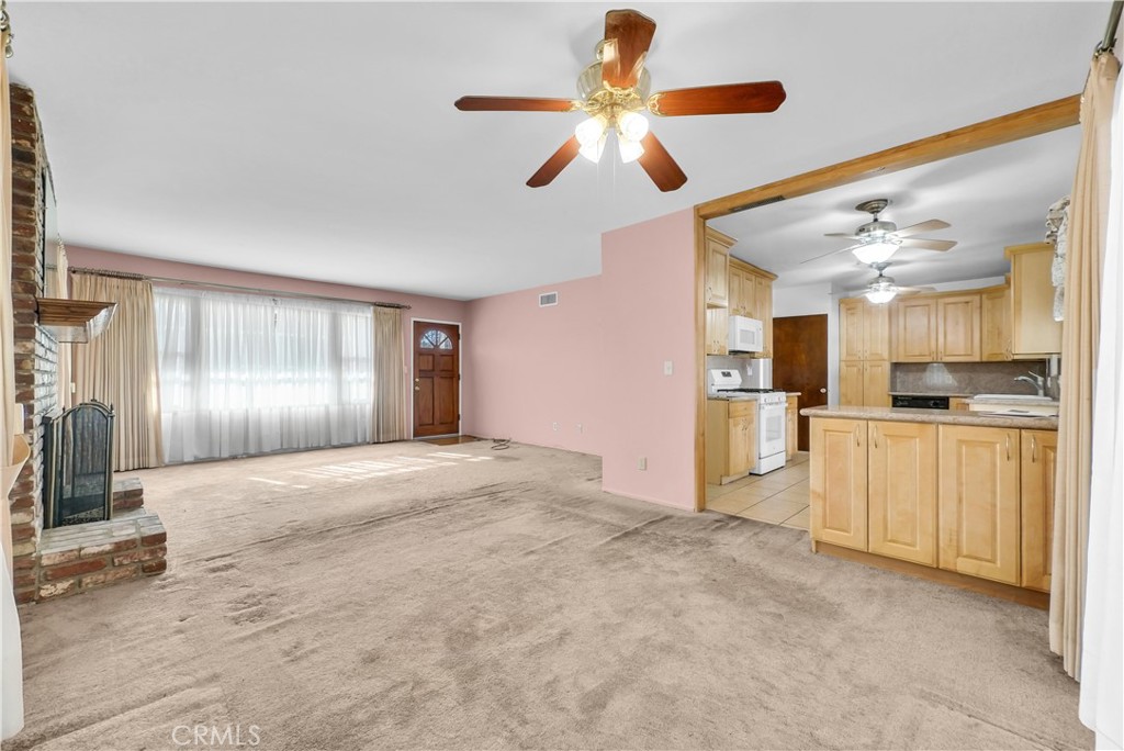 3921 Heidi Road Riverside, CA 92504 - Photo 5 of 20 a view of a kitchen with a sink and refrigerator