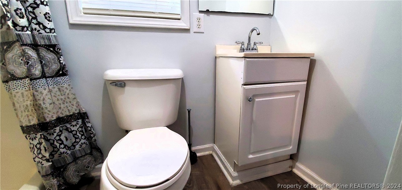 7780 Howell Road Lumberton, NC 28358 - Photo 19 of 27 a bathroom with a toilet and a sink