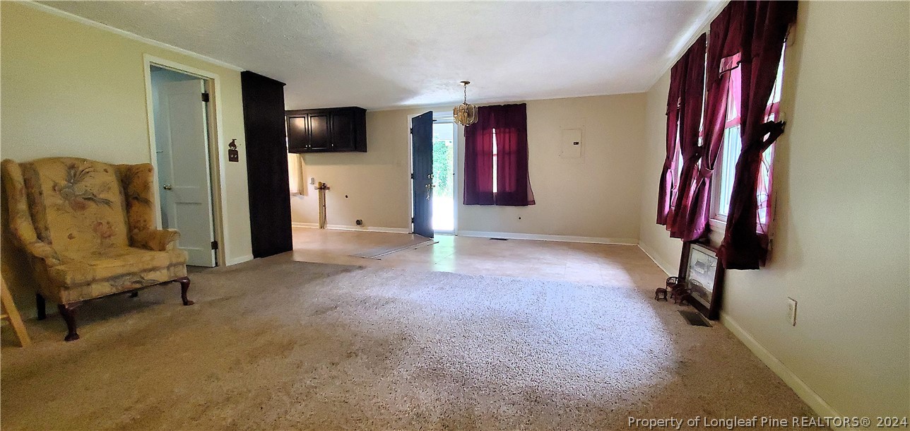 7780 Howell Road Lumberton, NC 28358 - Photo 9 of 27 a view of hall way with furniture and closet