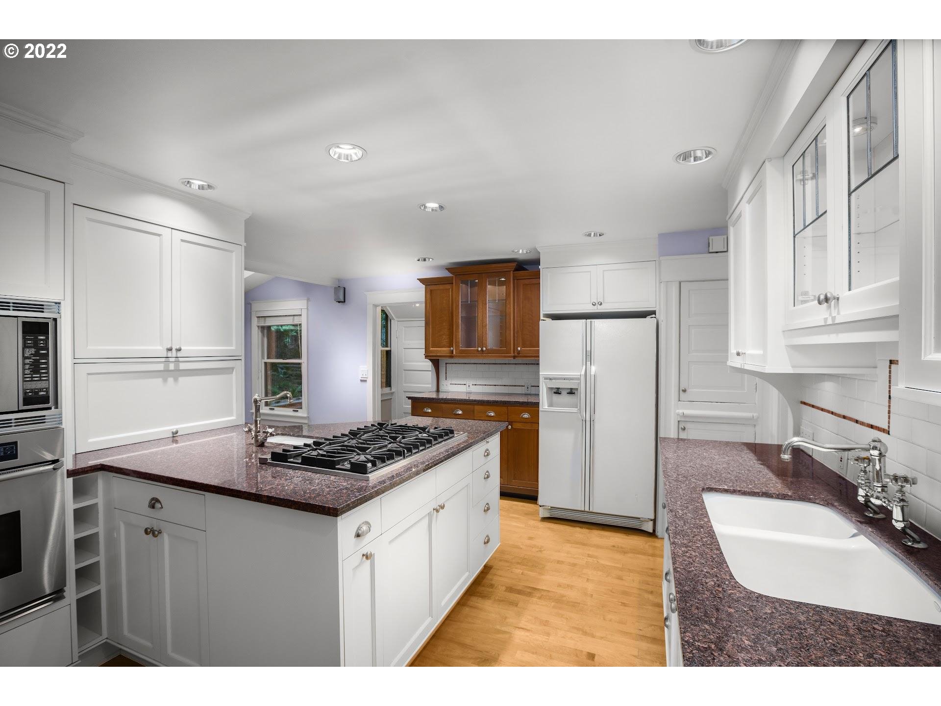 2554 Southwest Arden Road Portland, OR 97201 - Photo 5 of 26 a kitchen with refrigerator a stove a sink and a refrigerator