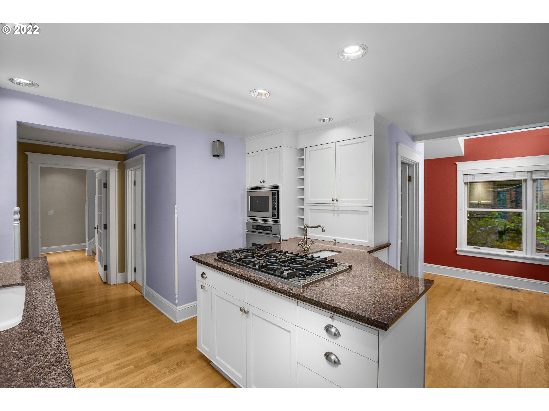 2554 Southwest Arden Road Portland, OR 97201 - Photo 6 of 26 a kitchen with stainless steel appliances granite countertop a sink stove and cabinets