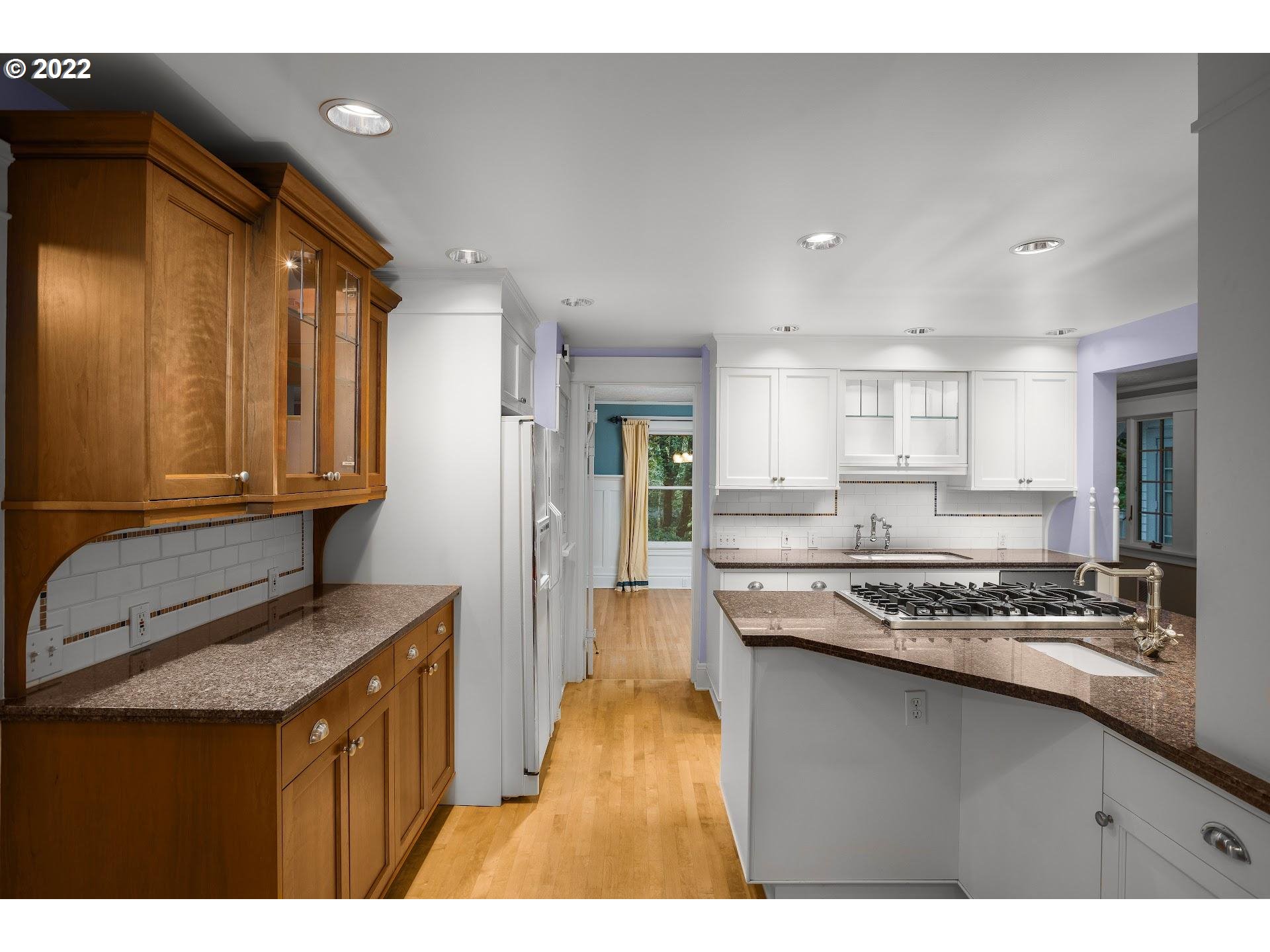 2554 Southwest Arden Road Portland, OR 97201 - Photo 7 of 26 a kitchen with stainless steel appliances granite countertop a sink stove and refrigerator