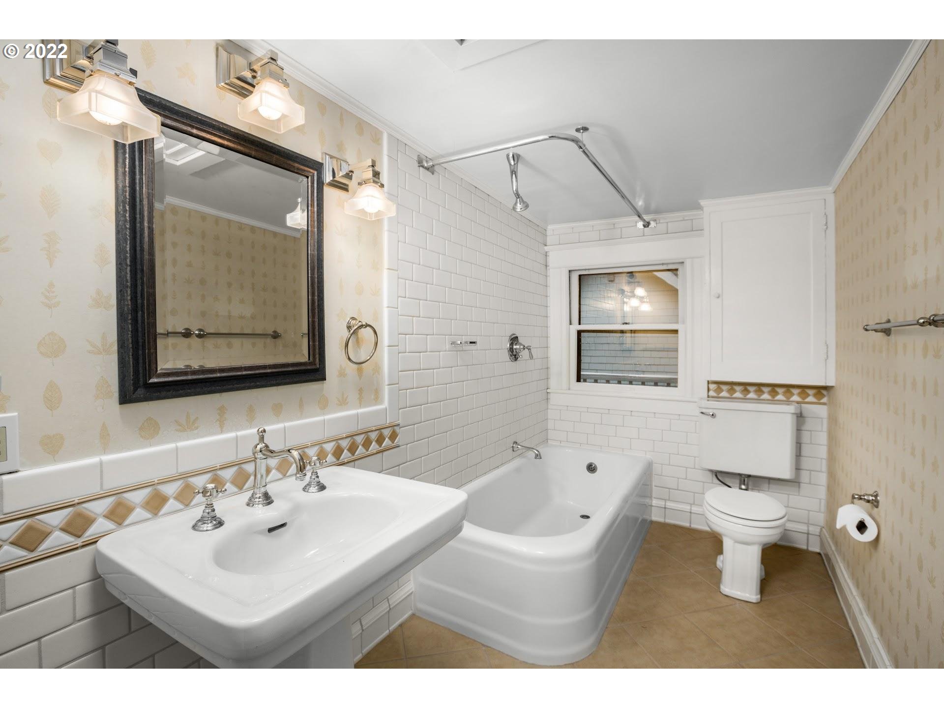 2554 Southwest Arden Road Portland, OR 97201 - Photo 8 of 26 a bathroom with a sink mirror toilet and bathtub